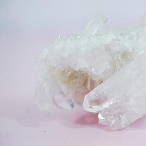 Close up of Crystal Quartz with pink background